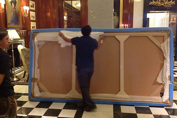 savoy artwork being installed by hogarth picture lights