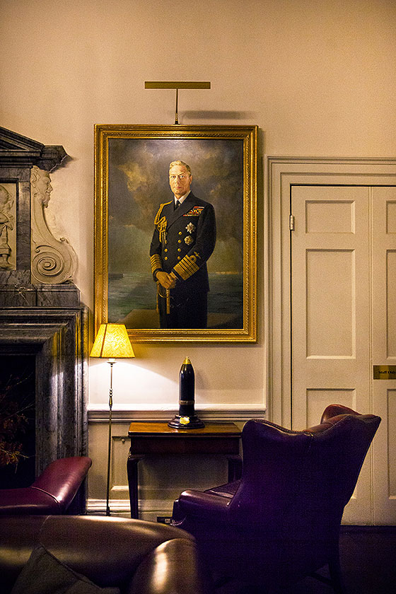 in and out club naval military club st james london interior shot of Hogarth picture lights painting of duke