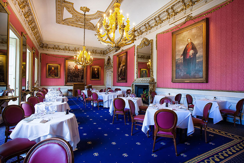 hogarth picture lights lighting some large paintings in the in and out club dining room